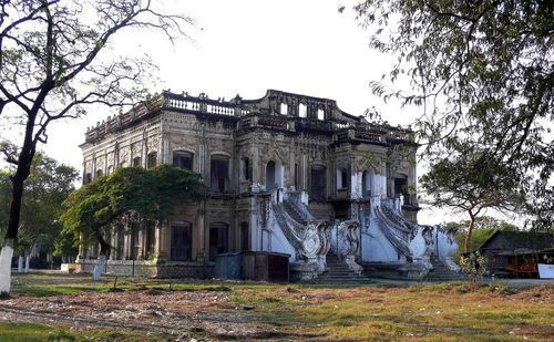 Old building with trees in background