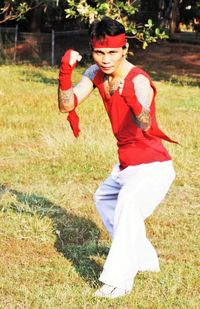 Full length of woman standing on field