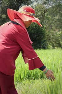 Rear view of man standing on field