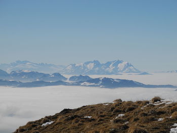 Scenic view of mountains against clear blue sky