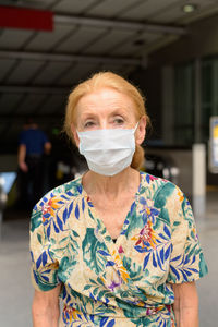 Portrait of woman standing outdoors