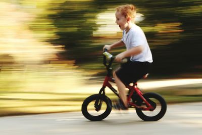 Side view of boy on bicycle