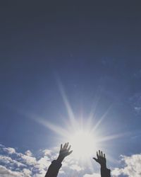 Man hand against sky