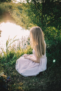 Woman sitting on field