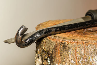 Close-up of rusty metal chain against white background