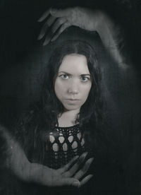 Digital composite portrait of young woman with ghost
