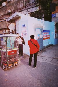 Rear view of man on street