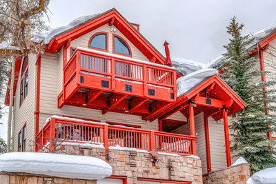 Low angle view of building covered with snow