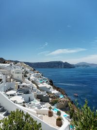 View of townscape against blue sky