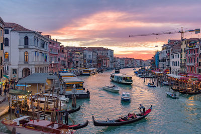 View of buildings in city during sunset