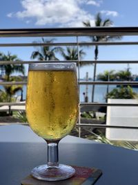 Close-up of beer glass on table