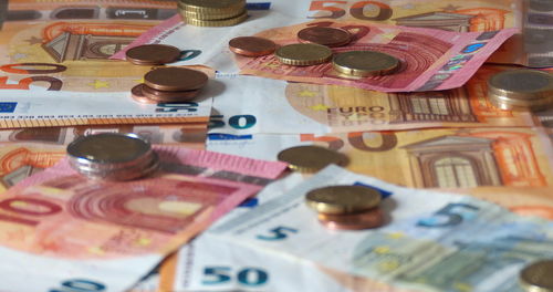 High angle view of coins on table