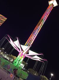 Low angle view of illuminated building at night