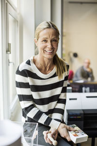 Portrait of confident businesswoman in creative office