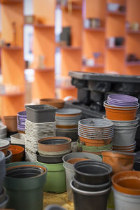 Reused plant pots stacked on table at recycling center