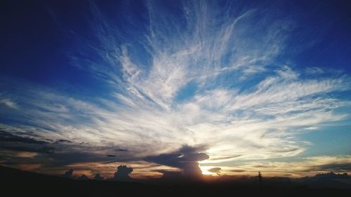 Scenic view of landscape against cloudy sky