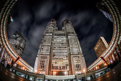 Low angle view of illuminated buildings in city