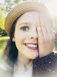 Close-up portrait of a beautiful girl, smiling happily and basking in sunshine