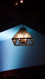 Low angle view of illuminated lamp against sky