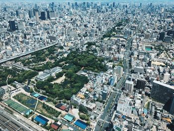 High angle view of crowd and buildings in city