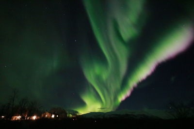 Low angle view of illuminated sky at night