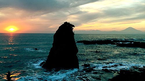 Scenic view of sea at sunset