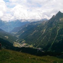 Scenic view of mountains against cloudy sky