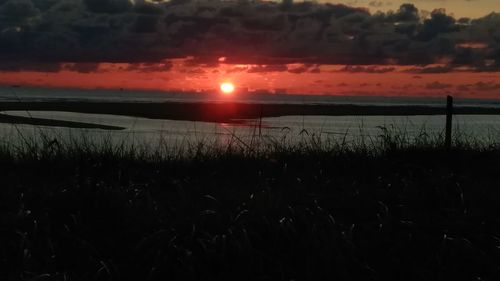 Scenic view of sea against sky during sunset