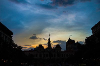 Cityscape against sky at sunset