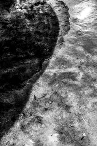 Close-up low section of sand on beach