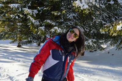 Portrait of woman in snow covered land