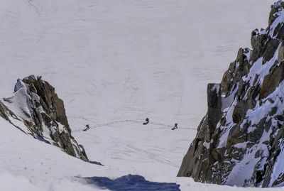 High angle view of people on snowcapped mountains during winter