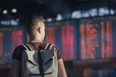 Traveling by airplane. portrait of man walking through airport terminal.