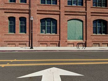 Road by building in city