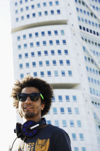 Portrait of man in front of turning torso building