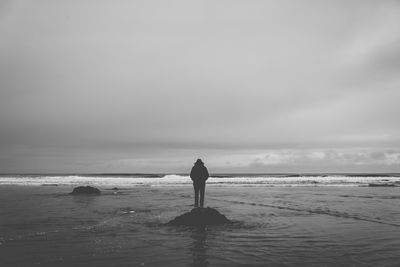 Silhouette man standing on beach