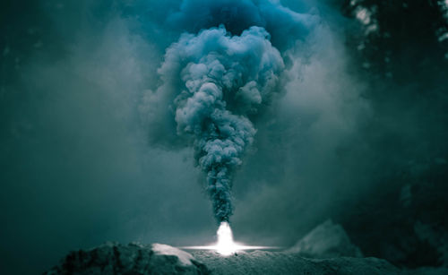 Smoke emitting from volcanic mountain