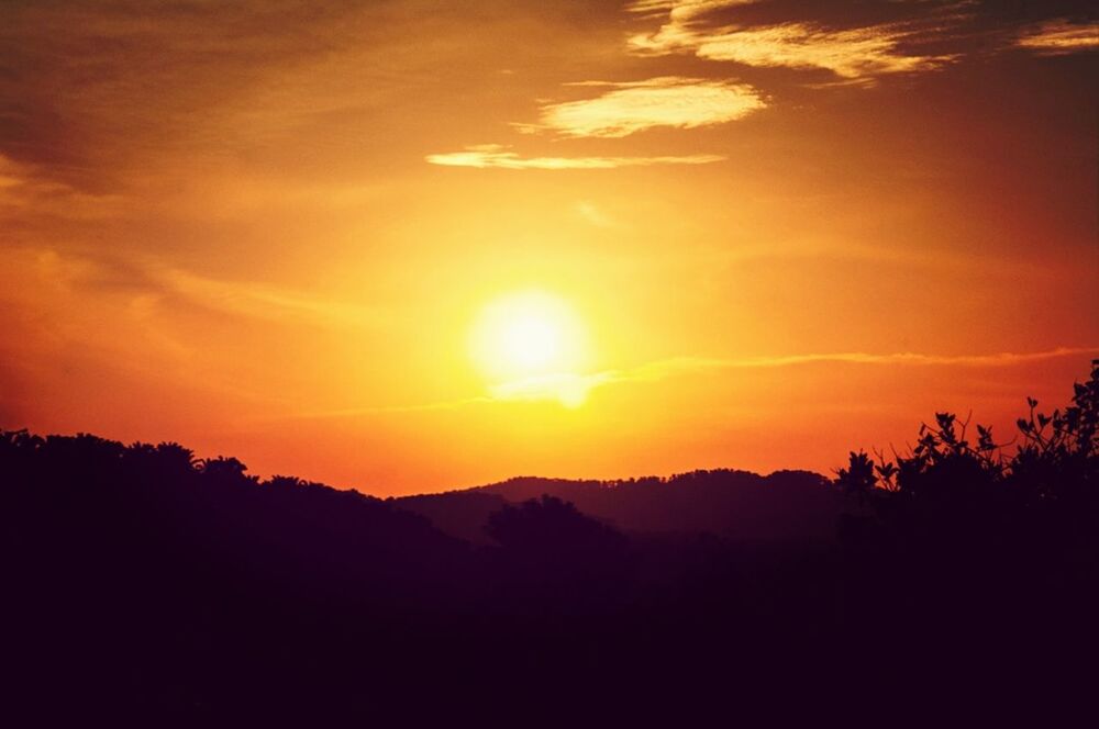 sunset, silhouette, scenics, tranquil scene, beauty in nature, tranquility, sky, orange color, sun, idyllic, mountain, nature, landscape, cloud - sky, tree, majestic, dramatic sky, cloud, sunlight, non-urban scene