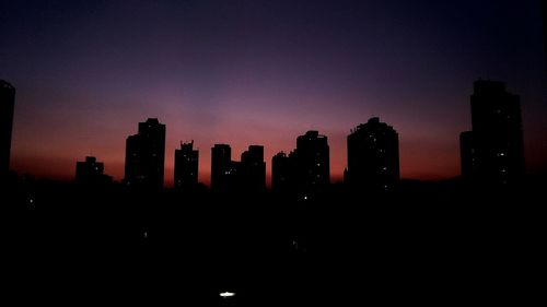 Silhouette of skyscrapers at night