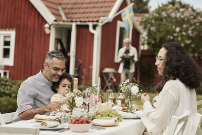 Family having meal in garden