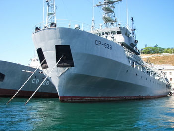 Ship sailing on sea against clear sky