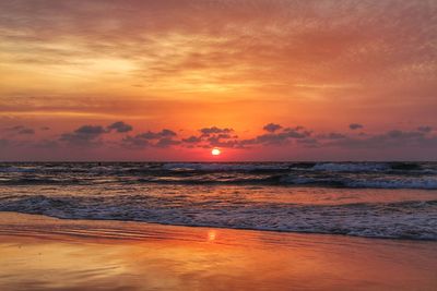 Scenic view of sea against romantic sky at sunset