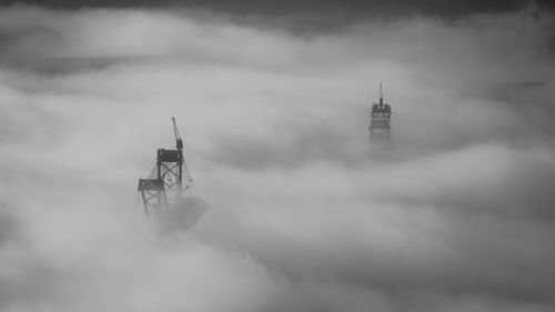 Low angle view of bagger standing in fog