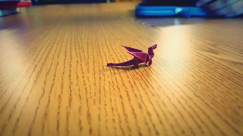 High angle view of paper dragon on table