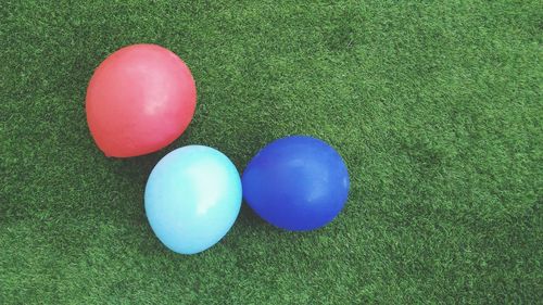 High angle view of colorful balloons on field