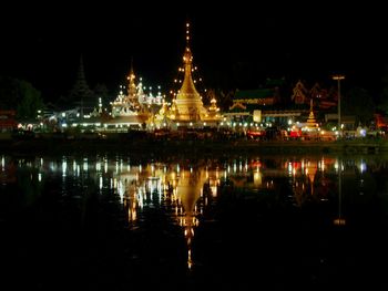Reflection of illuminated buildings in water