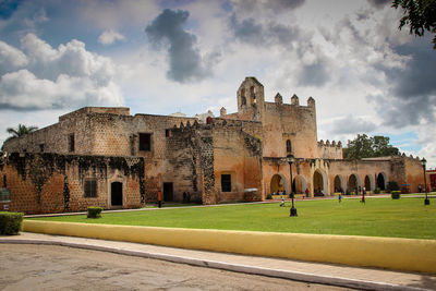 Old building against cloudy sky