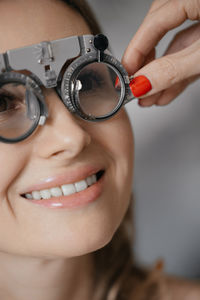 Close-up of woman holding clock