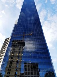 Low angle view of modern buildings against sky