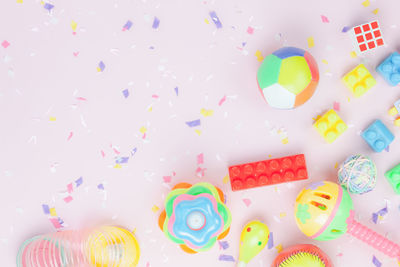 High angle view of multi colored candies on white background
